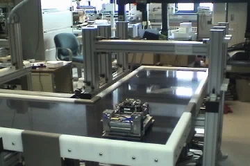 Video of a tetherless planar motor with onboard air pump moving in a line over a platen surface.